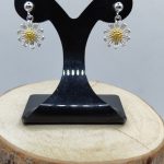 Sterling silver stud earrings with dangly daisies