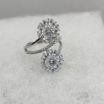 Sterling silver adjustable ring with double flowers with cubic zirconia detail
