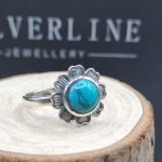 Sterling silver flower design ring with turquoise centerpiece
