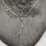 Sterling silver necklace with three small dangly crosses