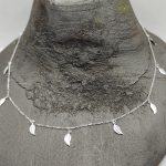 Sterling silver necklace decorated with small leaves