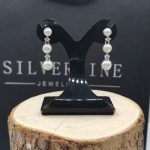 Sterling silver stud earrings with dangly freshwater pearls