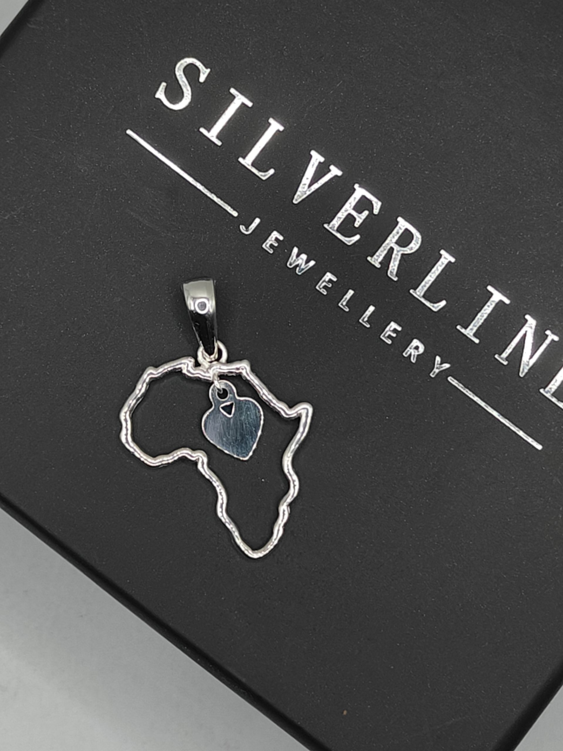 Sterling silver Africa cutout pendant with dangly heart